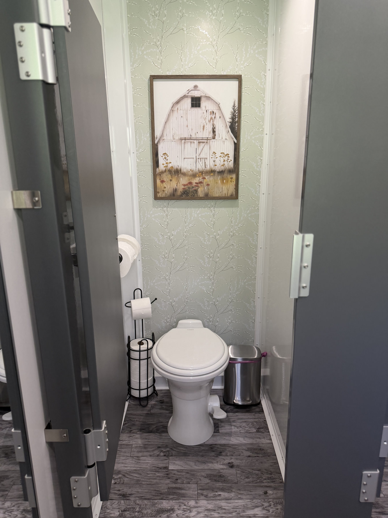 Flushing toilet in private stall of luxury restroom trailer rental