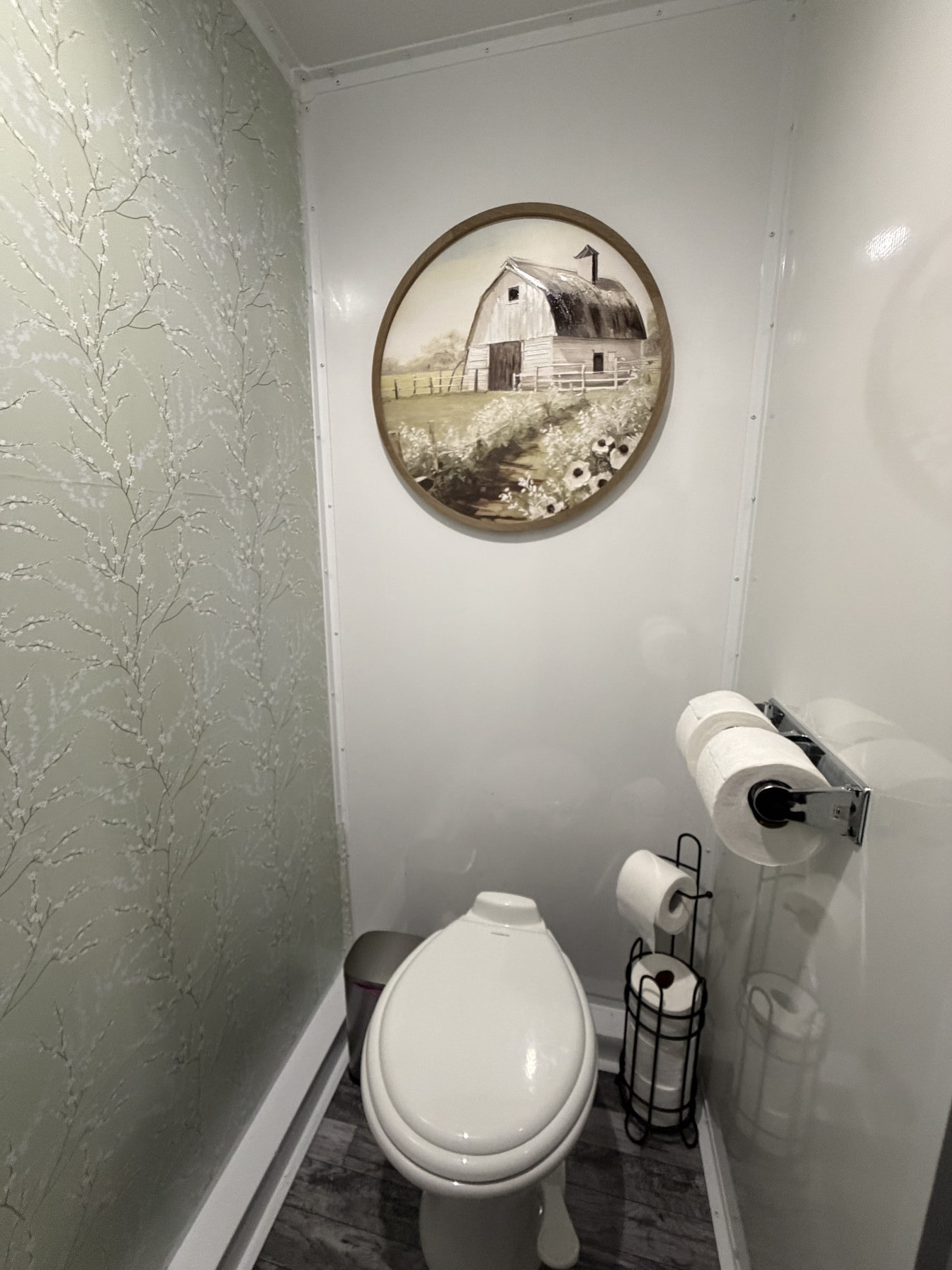 Private restroom stall with décor inside luxury restroom trailer